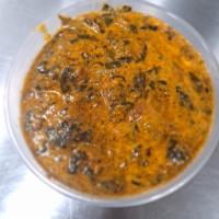 Lamb Saag   · Lamb cooked with spinach in seasoned herbs and spices.