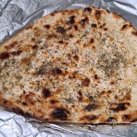 Garlic Basil Naan · Fresh made - baked in our tandoori oven