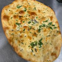 Cilantro Naan · Fresh made - baked in our tandoori oven