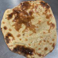 Tandoori Roti (1-piece) · Fresh made - flat round bread cooked in our tandoor oven