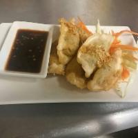 Thai Dumpling · Meat (blend of chicken and pork) or veggie. Served with sweet soy dipping sauce. Can be stea...