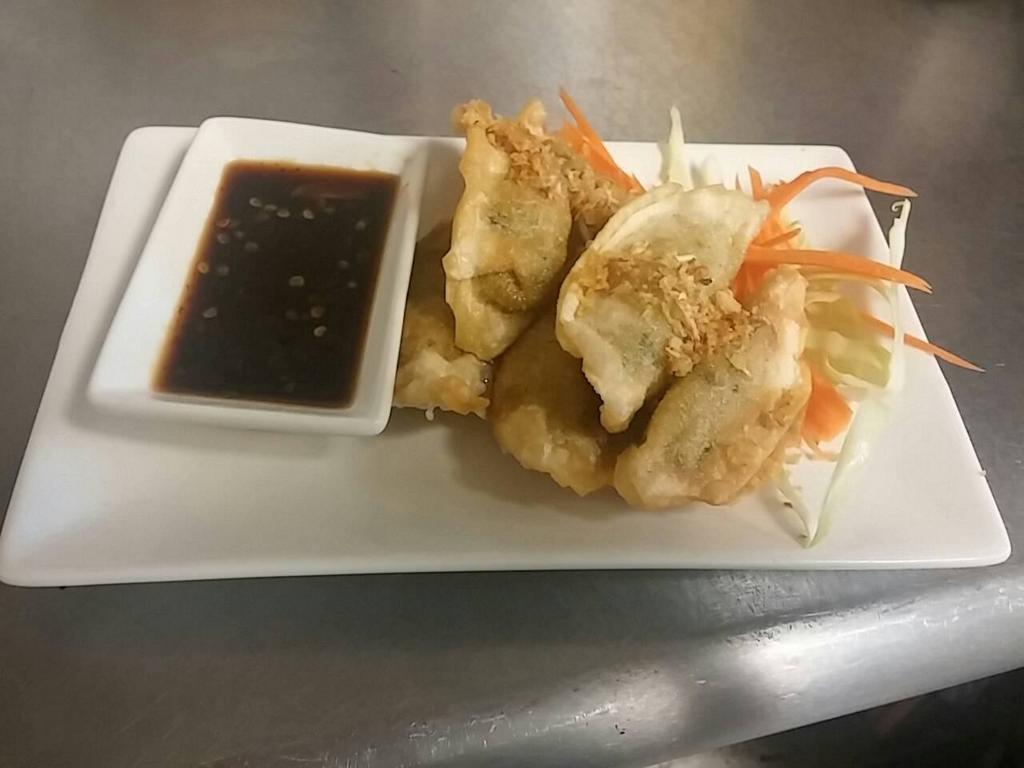 Thai Dumpling · Meat (blend of chicken and pork) or veggie. Served with sweet soy dipping sauce. Can be steamed or fried.