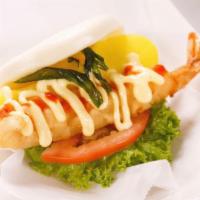 Shrimp Bun · 2 steamed handmade buns with tempura shrimp, pickled cucumber, red onion, fish roe, mixed gr...