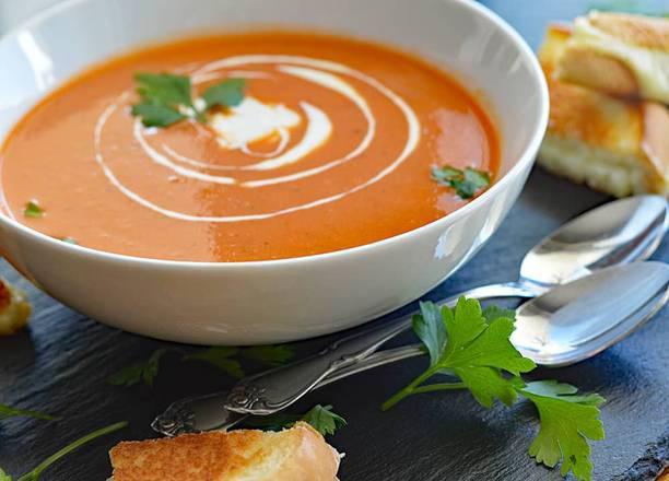 Tomato Soup · Homemade soup made with fresh tomatoes topped with crunchy croutons