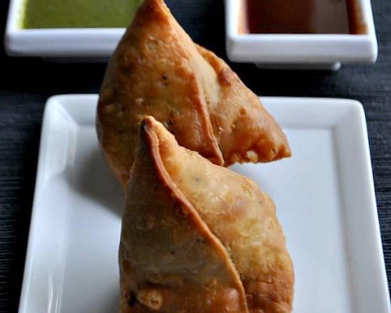 Samosa · Fried homemade street-food style pastry with savory filling such as potatoes, peas, lentils and spices