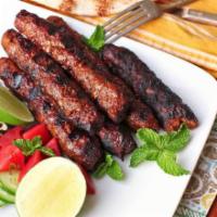 Lamb Seekh Kebab · Minced Lamb, onions, chilli, herbs, spices skewered baked in Tandoor