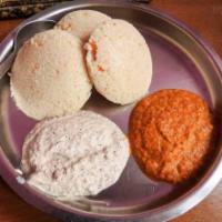 Idli · Steamed rice cakes made with fermented black lentils and rice