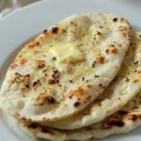 Jeera Naan · Naan pressed thin and garnished with cilantro and cumin seeds. Cooked in tandoor oven