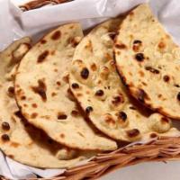 Tandoori Roti · Flat thin bread made from stone ground whole meal flour without pan and oil