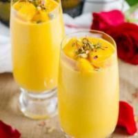 Mango Lassi · A popular Indian traditional refreshing yogurt drink churned with mango