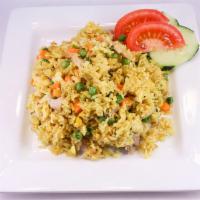 Nasi Goreng Kuning · Fried yellow rice topped with pork floss and choice of chicken, beef, pork, tofu or shrimp.