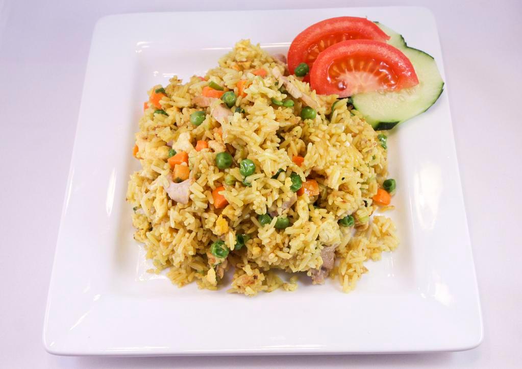 Nasi Goreng Kuning · Fried yellow rice topped with pork floss and choice of chicken, beef, pork, tofu or shrimp.