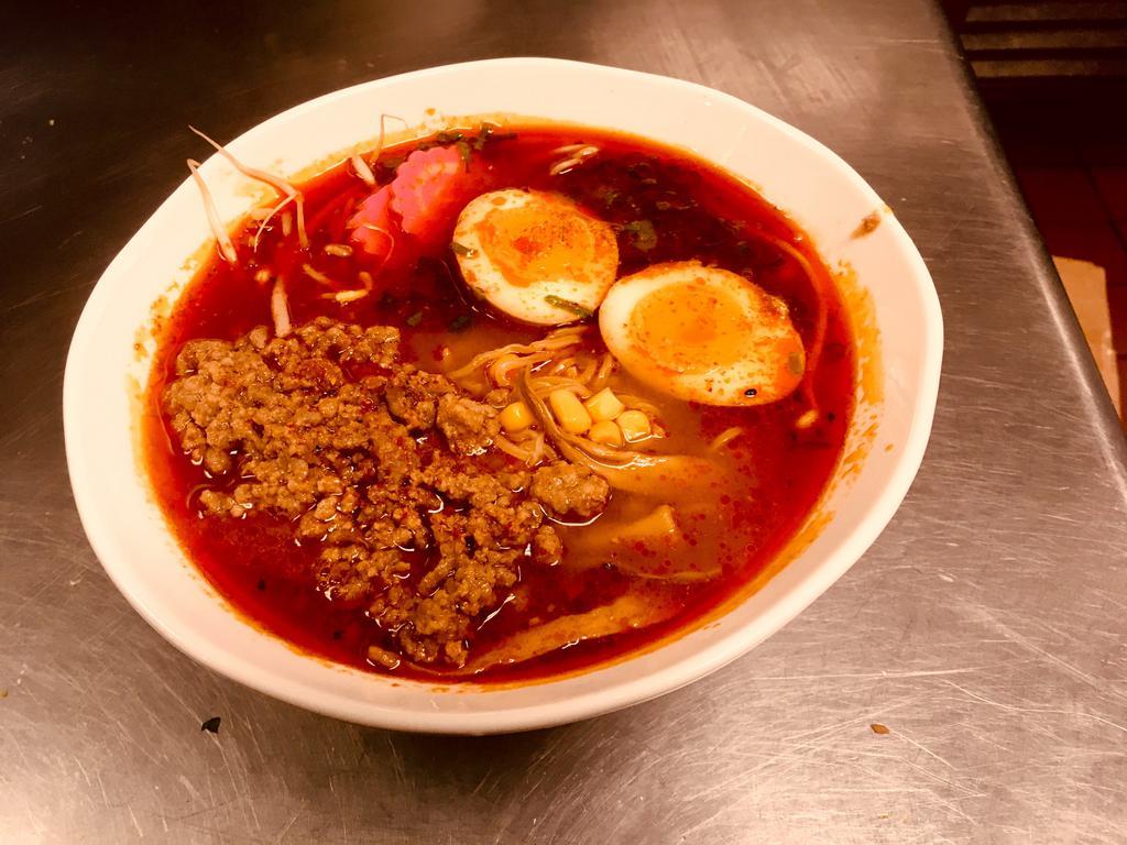Spicy Miso Ramen · Bone broth with miso favor based: ground pork, bamboo shoot, bean sprouts, chopped scallion, fish cake, sweet corn and soft boil egg