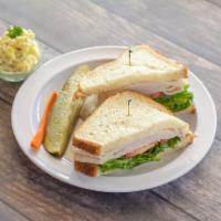 Turkey Cold Sandwich · Thinly sliced roasted turkey breast with lettuce, tomato slices and mayo.
