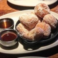 House-Made Doughnuts · Choice of local Dallas honey or chocolate sauce