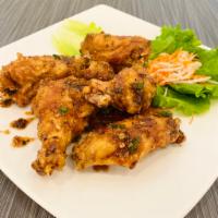 A7. Canh Ga Chien Nuoc Mam · Caramelized fish sauce chicken wings. Deep fried wings with fish sauce seasoning.