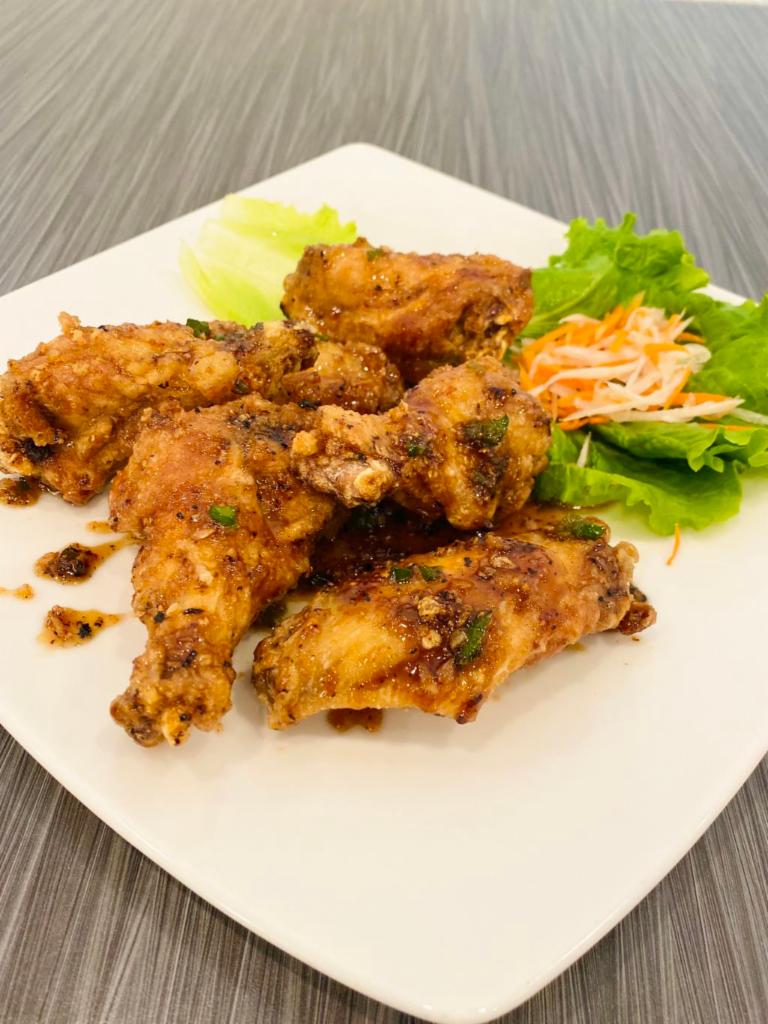 A7. Canh Ga Chien Nuoc Mam · Caramelized fish sauce chicken wings. Deep fried wings with fish sauce seasoning.