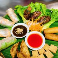 Appetizer Combo Platter · Combination of Spring rolls, egg rolls, fried tofu, potstickers, and salted caramelized chic...