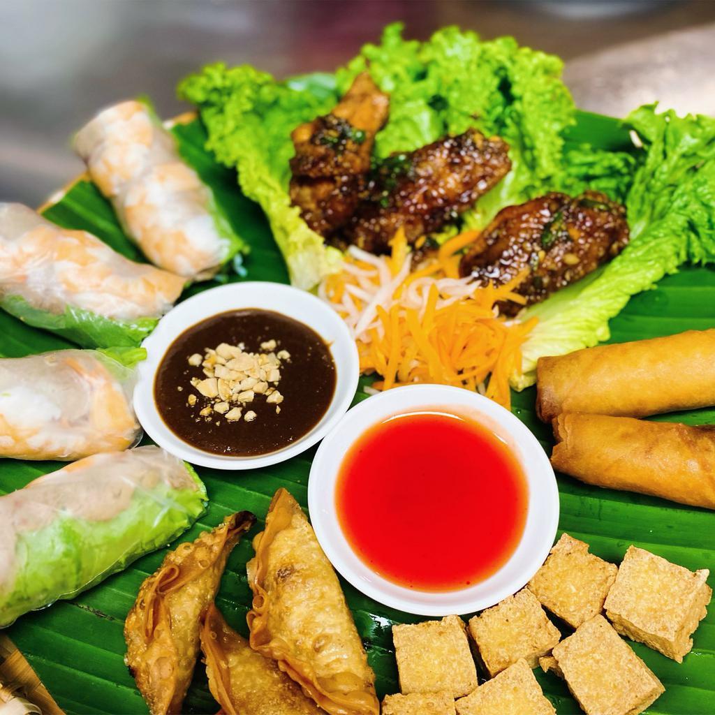 Appetizer Combo Platter · Combination of Spring rolls, egg rolls, fried tofu, potstickers, and salted caramelized chicken wings. 