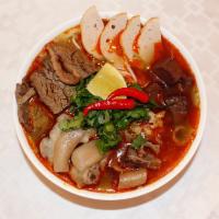 G1. Bun Bo Hue · Spicy noodle beef soup. Spicy beef noodle soup with fermented shrimp paste, lemongrass and d...