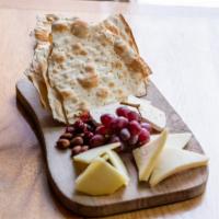 Artisan Cheese Board · Chef’s selection of seasonal cheeses and accoutrements.