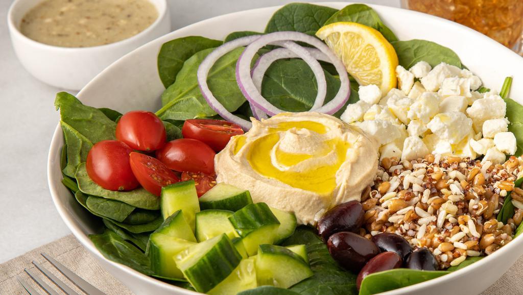 Super Med Bowl · Hearty Ancient Grains, hummus, spinach, feta, grape tomato,  red onion, Kalamata olives, cucumbers drizzled with olive oil and served with Greek dressing and a lemon wedge.