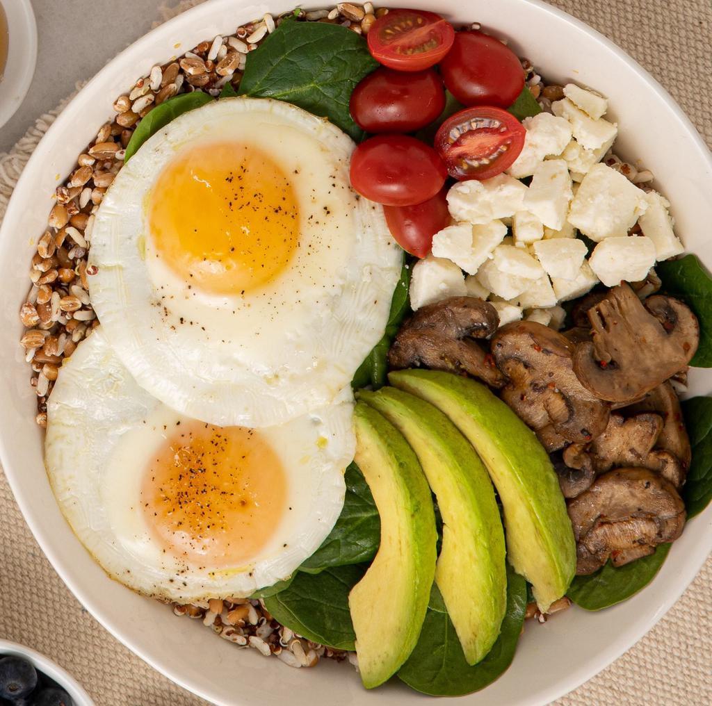 Power Bowl · Ancient grains, spinach, avocado, roasted mushrooms, tomatoes, feta topped with baked sunny side up eggs.