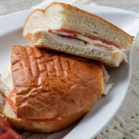 Turkey Club Panini · Turkey, bacon, tomato, provolone and honey mustard on focaccia. Served with a side of honey ...