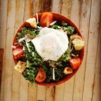 The Salad  · Chopped kale, shaved manchego cheese, house croutons, radish, fried egg, tomato, and sesame ...