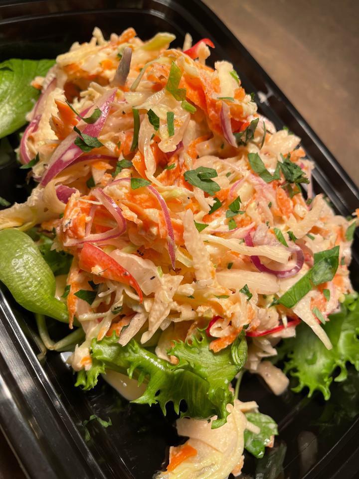 Latin Slaw · napa cabbage / cabbage / red onions / cilantro / jicama / red peppers / carrots / cole slaw dressing