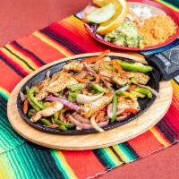 Fajitas (steak or chicken) · Steak or chicken. Rice, beans, salad, guacamole and handmade corn tortillas or flour.