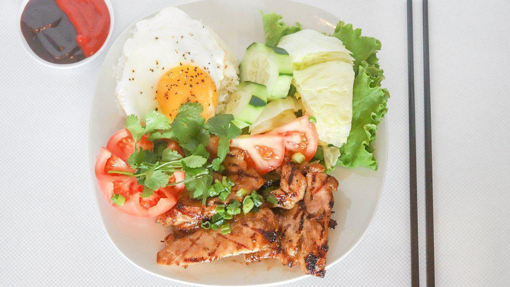 13. Grilled Chicken Combo Over Rice · Grilled chicken, egg rolls, grilled shrimp and a fried egg (Com ga nuong, cha gio, tom nuong, trung)