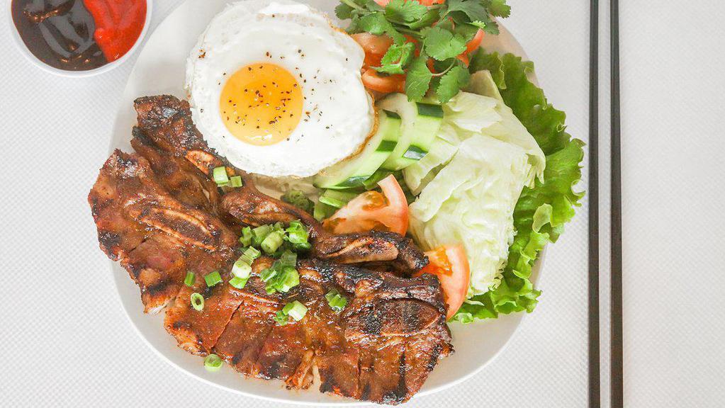 14. Grilled Beef Short Ribs Combo Over Rice · Grilled beef short ribs, egg rolls, grilled shrimp and fried egg (Com ga nuong, cha gio, tom nuong, trung)