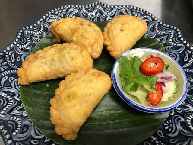 Curry Puffs · Minced chicken, potato, mixed peas & carrots, opinion in puff pastry with cucumber vinaigrette dip