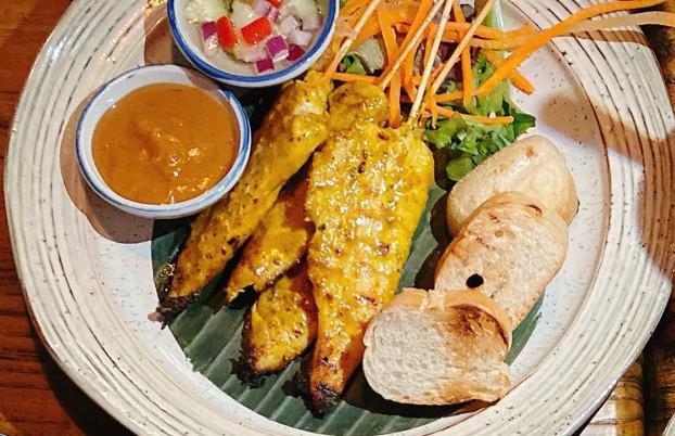 Chicken Satay · Grilled marinated chicken tenders on skewers. Served with toasted bread, peanut sauce, and cucumber vinaigrette dip.