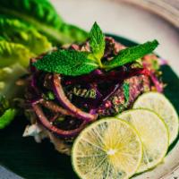 Beef Salad (Neua Nam Tok) · Grilled marinated beef, shallots, roasted rice powder, red onion, mint, cilantro, scallion, ...