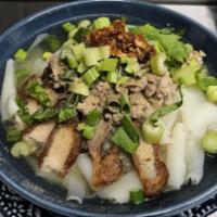 Rice Noodle Rolls · Kuai jap nam sai. Each bowl is topped with crispy pork and drenched in peppery broth.