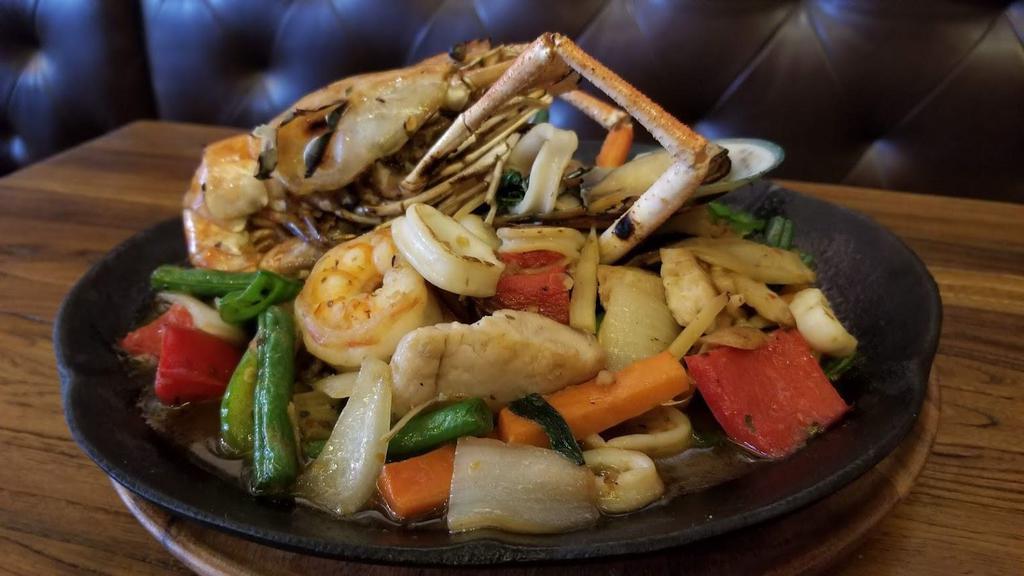 Pad Cha · Sauteed mixed seafood with white wine, mushroom, long hot pepper. Lime leaf, carrot, onion, string beans, and Thai herbs in chili basil sauceserved with jasmine rice . Medium spicy.