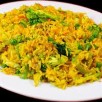 Nepali Style Fry Rice · Fried basmati rice with green vegetables, red and green peppers, and house spices.