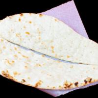 Plain Naan · Teardrop-shaped flatbread baked in tandoor (clay oven). Gluten.