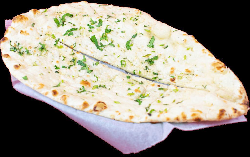 Garlic Naan · Teardrop-shaped flatbread with light garlic baked in tandoor (clay oven). Gluten.
