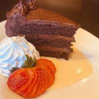 CHOCOLATE TRIPLE LAYER CAKE · Frangelico laced devil’s food chocolate cake, chocolate cream cheese frosting, vanilla crème...