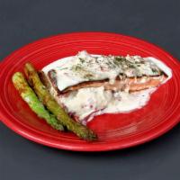 Satchmo's Salmon · Blackened Norwegian salmon topped with a rich crab beurre blanc sauce served with garlic mas...
