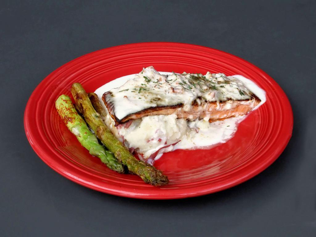 Satchmo's Salmon · Blackened Norwegian salmon topped with a rich crab beurre blanc sauce served with garlic mashed potatoes and grilled asparagus.