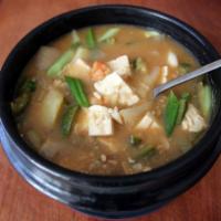 6. Doenjang Jjigae · Traditional bean paste, Tofu and Vegetables in soup