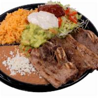 Beef Short Ribs Plate (Costillas de Res) · Beef short ribs grilled fresh to order. Served with salad, guacamole, chipotle, ranch, rice ...