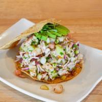 Tostada Especial · Cooked and raw special, octupus, scallops, fish