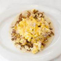 Texas Tacos · Eggs, hash browns, ham, and cheese on a flour tortilla.
