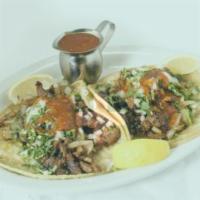 Regular Tacos · A la carte. Soft shells corn or flour, with cilantro, lettuce, onions, Jack and cheddar chee...