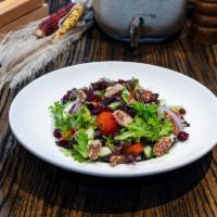 De La Casa Salad · Mixed greens, cherry tomatoes, cucumbers, red onions, dried cranberries, and pecans, with ho...